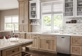 Modern kitchen featuring wooden cabinets and stainless steal appliances.