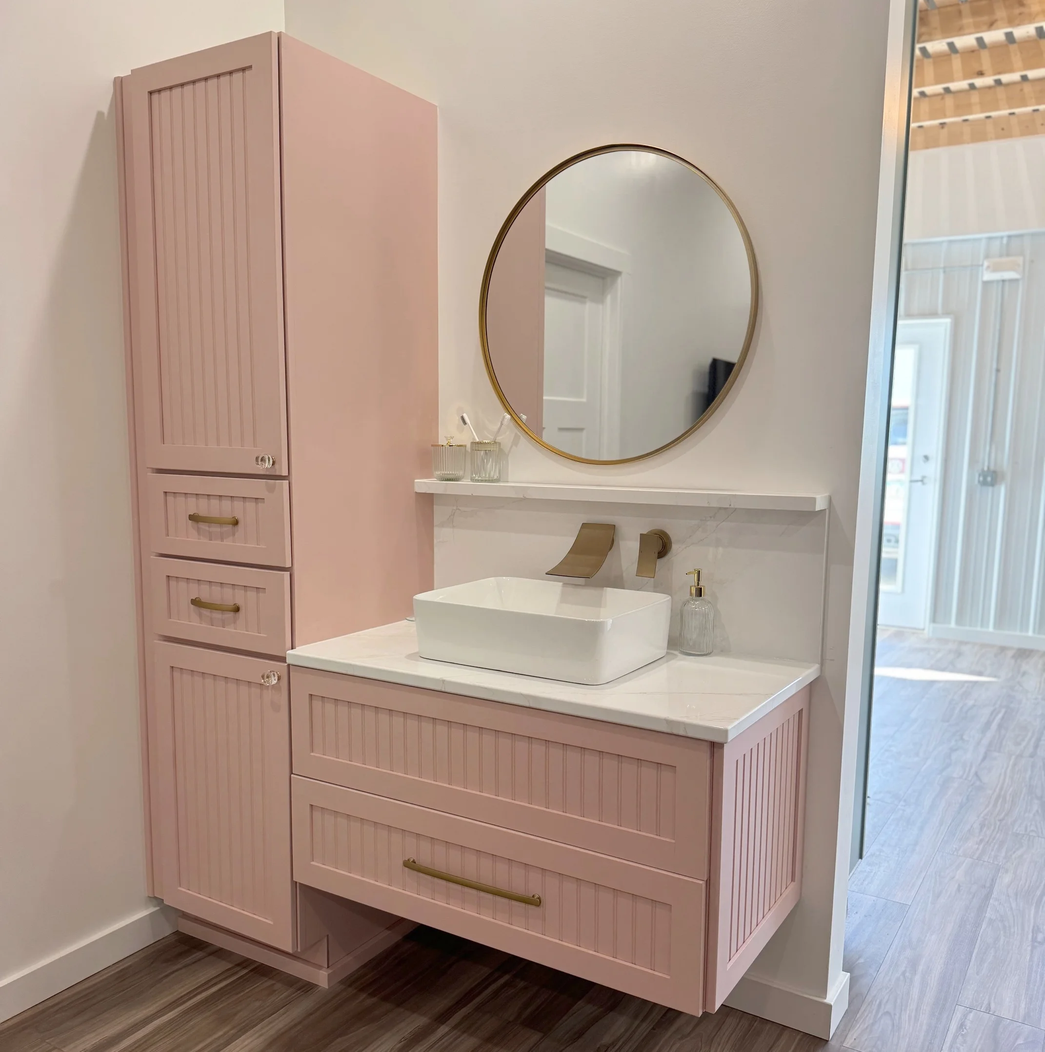 bathroom renovation with pink cabinets
