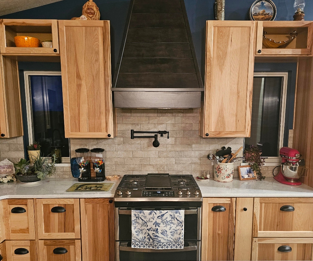 kitchen remodel with Yorktowne Hickory with natural stain and onyx stain on hood and island