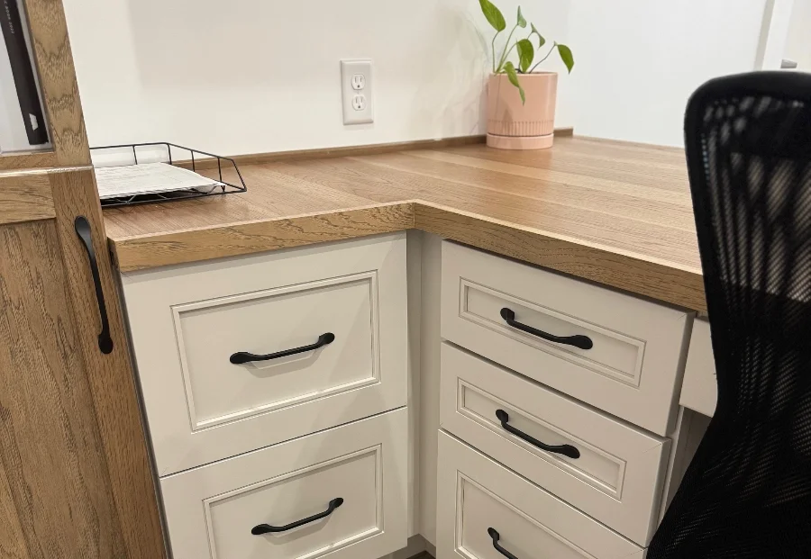 Custom commercial cabinetry for desks in an office in Iowa